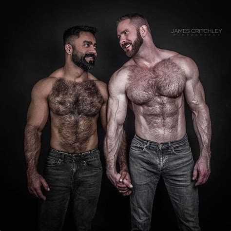 Two Shirtless Men Standing Next To Each Other