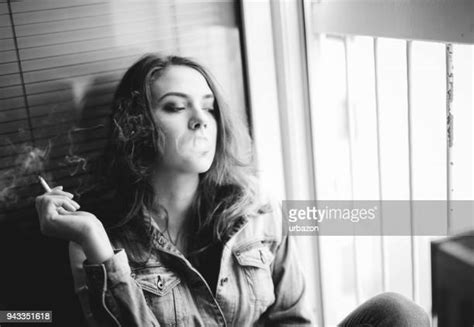 Elegant Woman Smoking Cigarette Posing In Studio Bandw Portrait