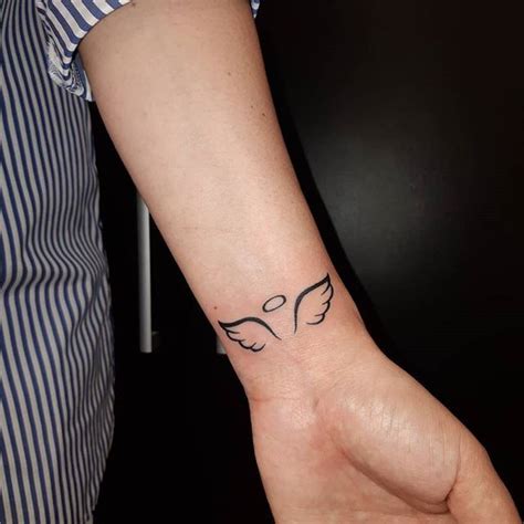 Guardian Angel Wing Tattoos On Wrist Wrist Tattoos Girls Tiny Tattoos