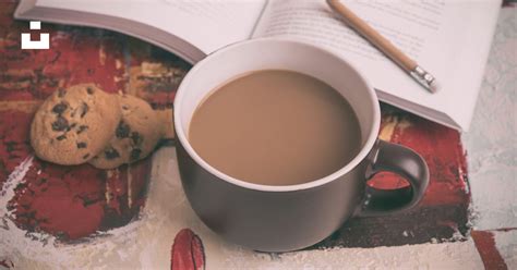 Beverage Filled Mug Beside Cookie And Book Photo Free Coffee Image On
