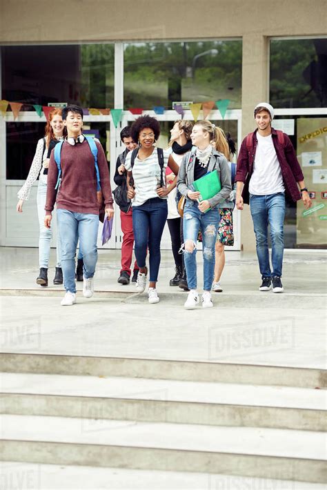 College Students Walking On Campus Between Classes Stock Photo Dissolve