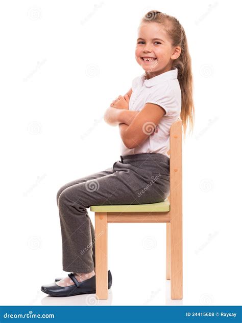 Little Girl Sitting On A Chair And Smiling Stock Photo Image Of