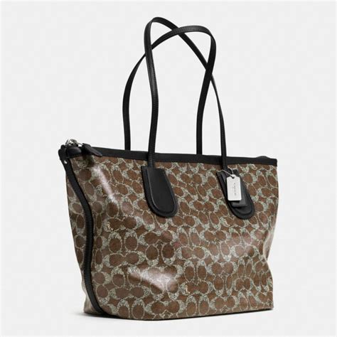 Lyst Coach Taxi Zip Top Tote In Signature Coated Canvas In Brown