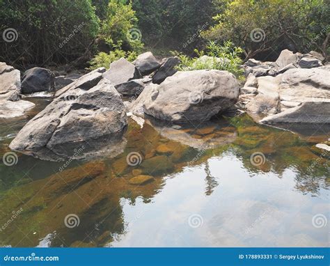 Beautiful Landscape With Huge Boulders Through Which The River Stock