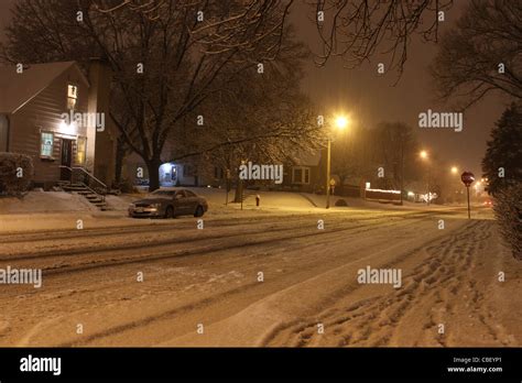 A Street At Night In A Snow Storm In Minneapolis Minnesota Stock Photo