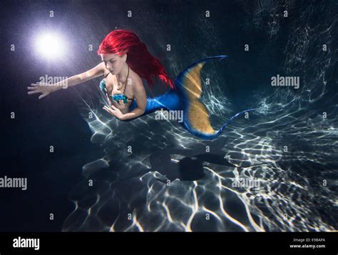 Redhead Mermaid Swimming In A Pool In Virginia Beach Virginia Stock