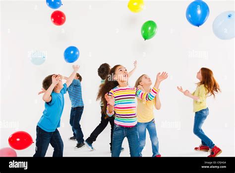 Children Playing With Balloons Stock Photo Alamy