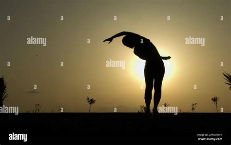 Woman Bending Silhouette Hi Res Stock Photography And Images Alamy