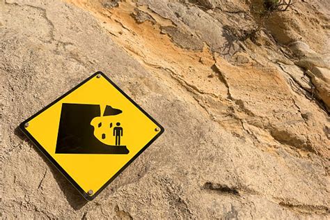 Falling Rock Sign Pictures Images And Stock Photos Istock