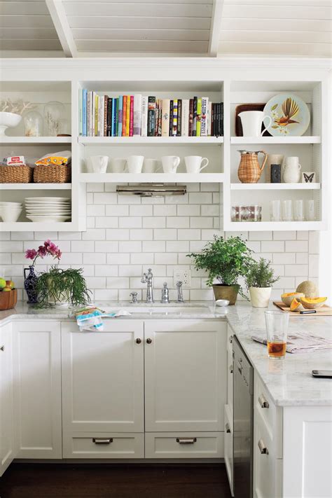 To open up a smaller space, consider using bright colors in your kitchen. Crisp & Classic White Kitchen Cabinets - Southern Living