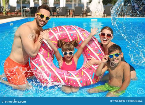 Family Having Fun In Swimming Pool Stock Image Image Of People Background