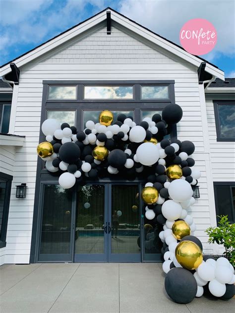 Black And White Balloon Garland Installation In 2020 Black And White