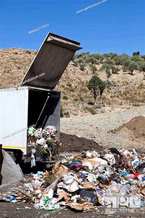 Truck Dumping Refuse Into Landfill Stock Photo Picture And Royalty