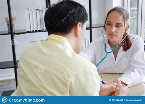 Caucasian Female Psychiatrist Is Counseling And Encouraging For Asian Man Have Mental Health