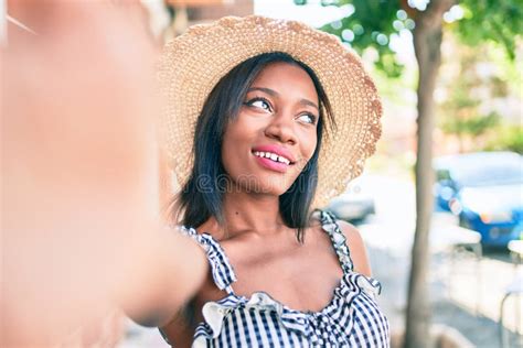 Young African American Woman On Vacation Smiling Happy Making Selfie By The Camera At Street Of