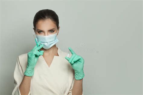 Doctor Nurse Or Scientist In Blue Gloves Holding Syringe And Ampoule
