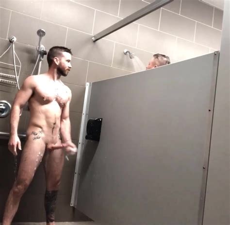 Muscle Guy Jerking In Public Showers With An Other Guy Next Stall