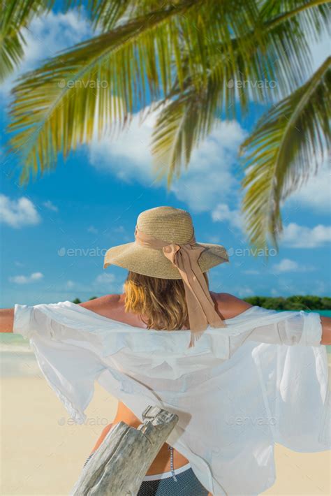 Woman In Bikini With Sunhat At The Beach Stock Photo By Netfalls Photodune