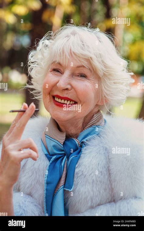 Smiling Senior Elegant Stylish Fashionable Woman With Grey Hair In Fur