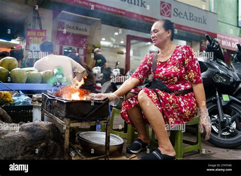 hoi an vietnam 9th nov 2023 a woman is seen cooking street food in the streets of hanoi the