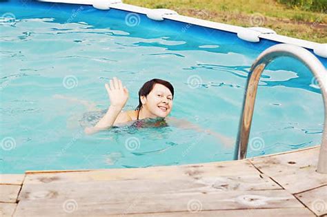 Pretty Woman Is Swimming In A Pool Stock Image Image Of Attractive