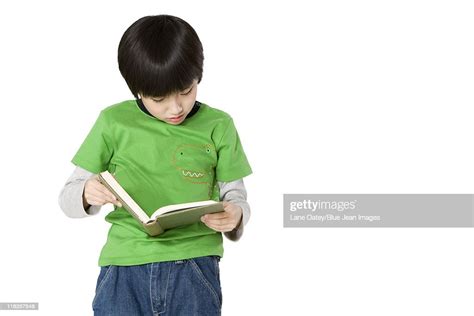 Young Boy Reading A Book High Res Stock Photo Getty Images