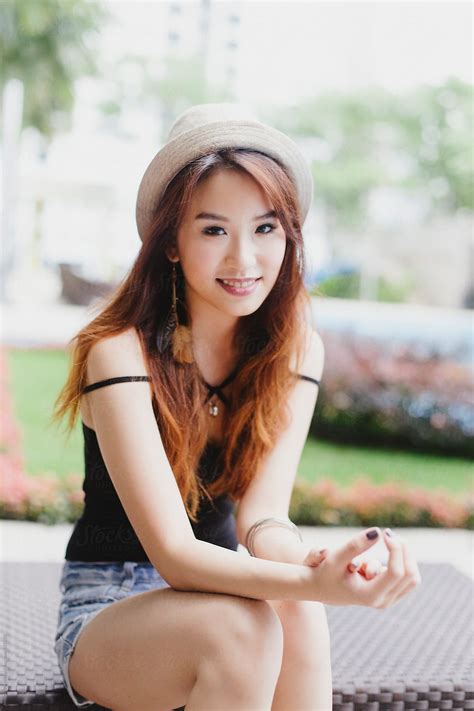 beautiful chinese woman looking happy by Jessica Lia - Stocksy United