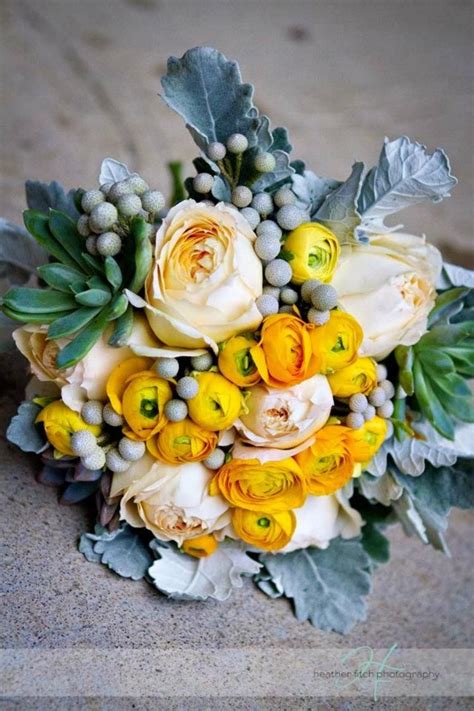 Very rustic natural looking bridal bouquet with twisted branch armature. gray and yellow wedding flowers garden roses, yellow ...