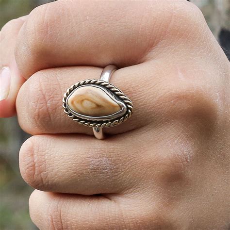 This Elk Ivory Tooth Trophy Antler Ring Is Featured In Sterling Silver