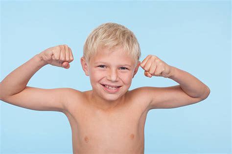70 Boy Flexing Muscles At The Beach Stock Photos Pictures And Royalty
