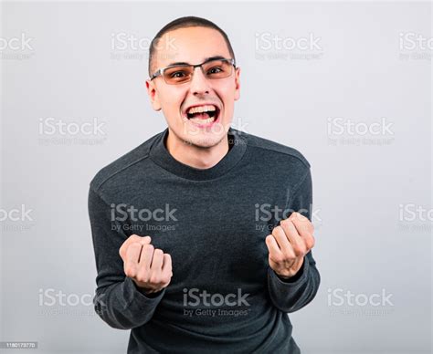 Angry Young Man Shouting With Open Mouth And Very Anger Face Showing