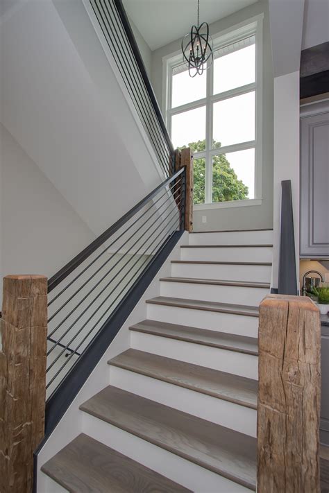 Horizontal fencing has been around forever but has recently surged in popularity. Stair: Rustic stained wood beams, handcrafted by Kalamazoo ...