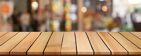 Cropped Wood Table Top On Blur Bokeh Shopping Mall Background Can Be