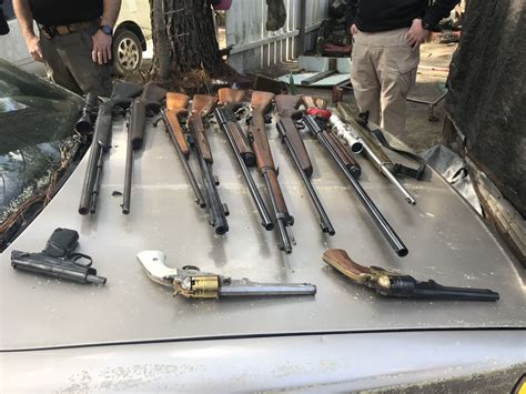 Couple Arrested After Deputies Find Illegal Guns Stolen Cars At Compound