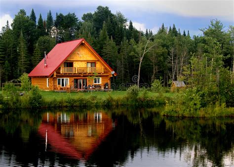 Maybe you would like to learn more about one of these? Log Cabin On A Lake stock image. Image of woods, house ...