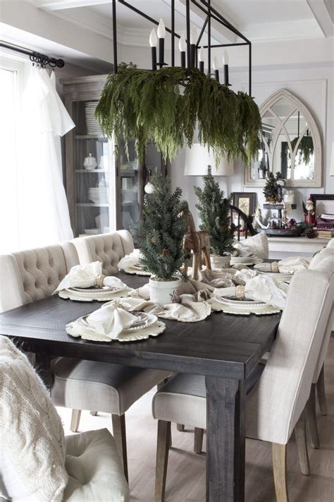 Elegant and simple greenery adds drama when draped from the chandelier