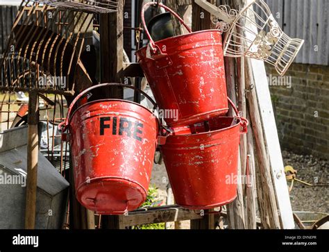Old Fire Buckets Hanging Up Stock Photo Alamy
