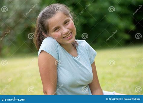 Pretty Young Smiling Teenager Girl In The Grass Stock Photo Image Of
