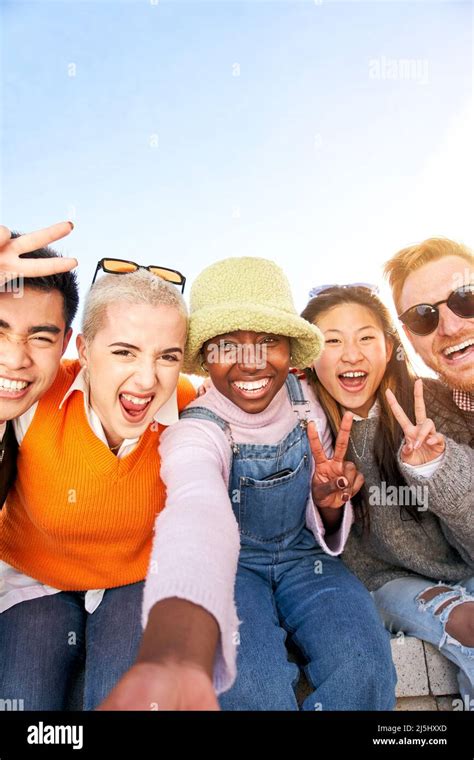 Vertical Smiling Selfie Of A Happy Group Of Multicultural Friends
