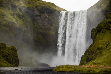 Waterfalls On Green Grass Field During Daytime Photo Free Nature