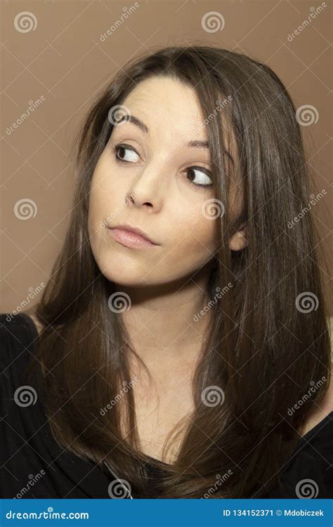 A Young Woman Looking Sideways Stock Image Image Of Melancholy Brunette 134152371