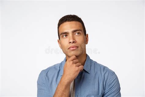 Close Up Thoughtful Brazilian Man Rubbing Chin And Looking Up Pondering Idea Have Some Plan