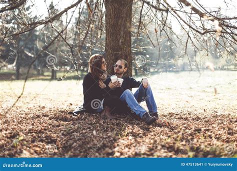 Couple Sitting Under A Tree Stock Image Image Of Romance Coffee