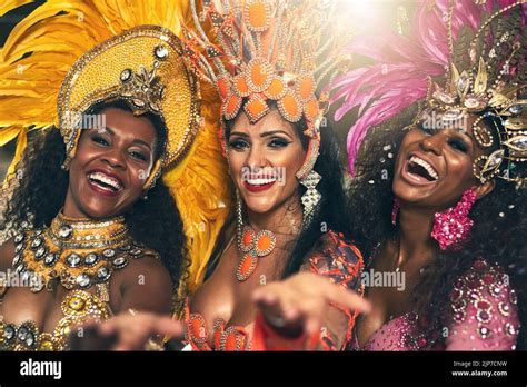 from brazil with love cropped portrait of three beautiful samba dancers performing at carnival