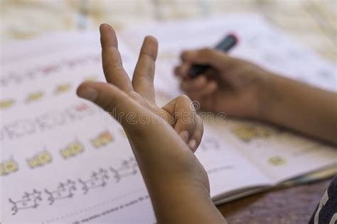 Child`s Hand Doing Math While Counting On Fingers Stock Image Image