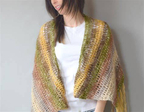The crochet boho shawl uses only chains and double crochet in a variety of different patterns to create an interesting look. Boho Crochet Shawl Pattern | FaveCrafts.com