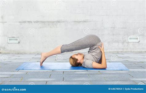 Woman Making Yoga In Plow Pose On Mat Outdoors Stock Photo Image Of