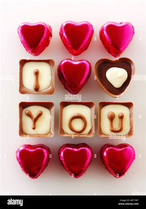I Love You Written In Chocolates With Red Heart Shaped Chocolates Stock