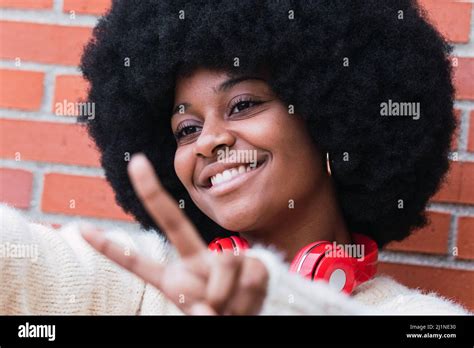 Closeup Portrait Of Beautiful African American Woman With Afro Hairstyle White Jumper And Eyes