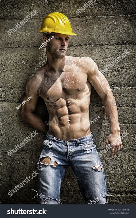 Handsome Construction Worker Standing Shirtless Front Stock Photo